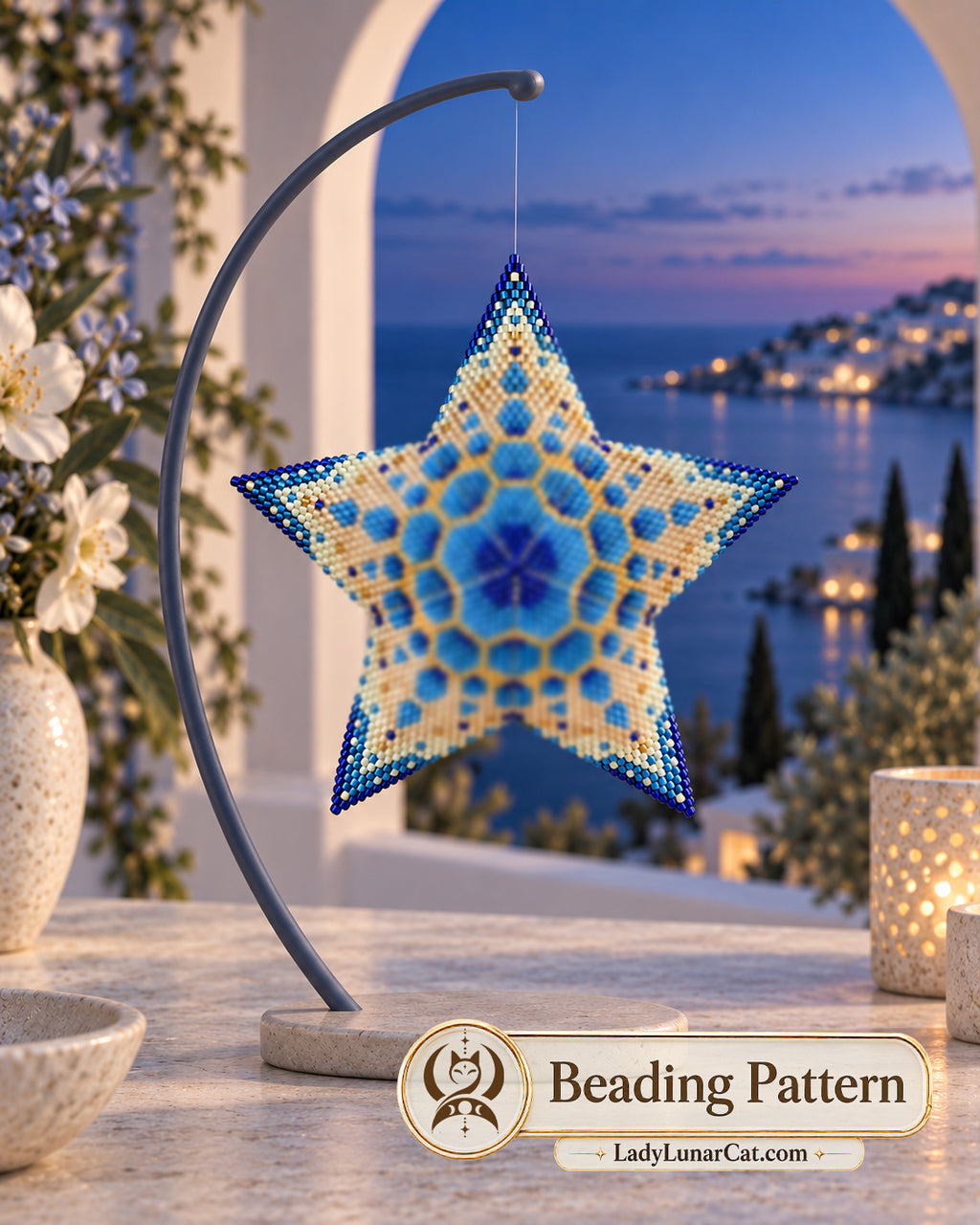 Sea Snowflake pattern preview showing a blue, cream and gold beaded star on a dark curved stand by the sea at twilight.